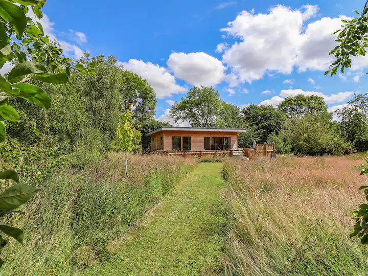 picture of a cabin in a field