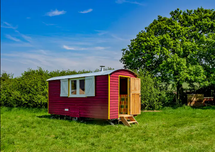 picture of a hut in a field